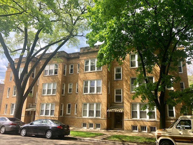 a view of a car parked in front of a building