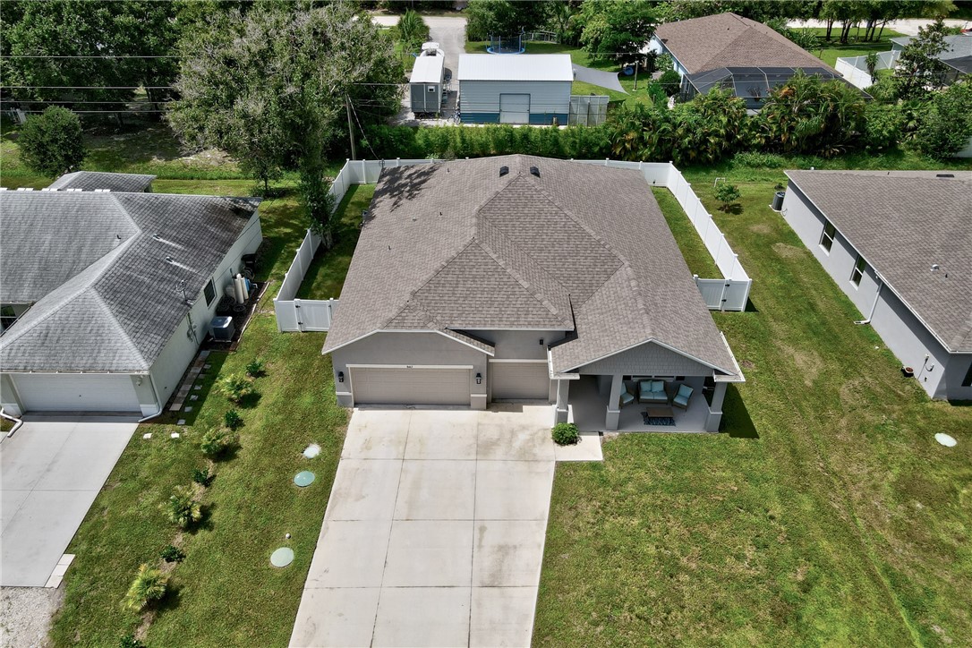 a aerial view of a house with a yard