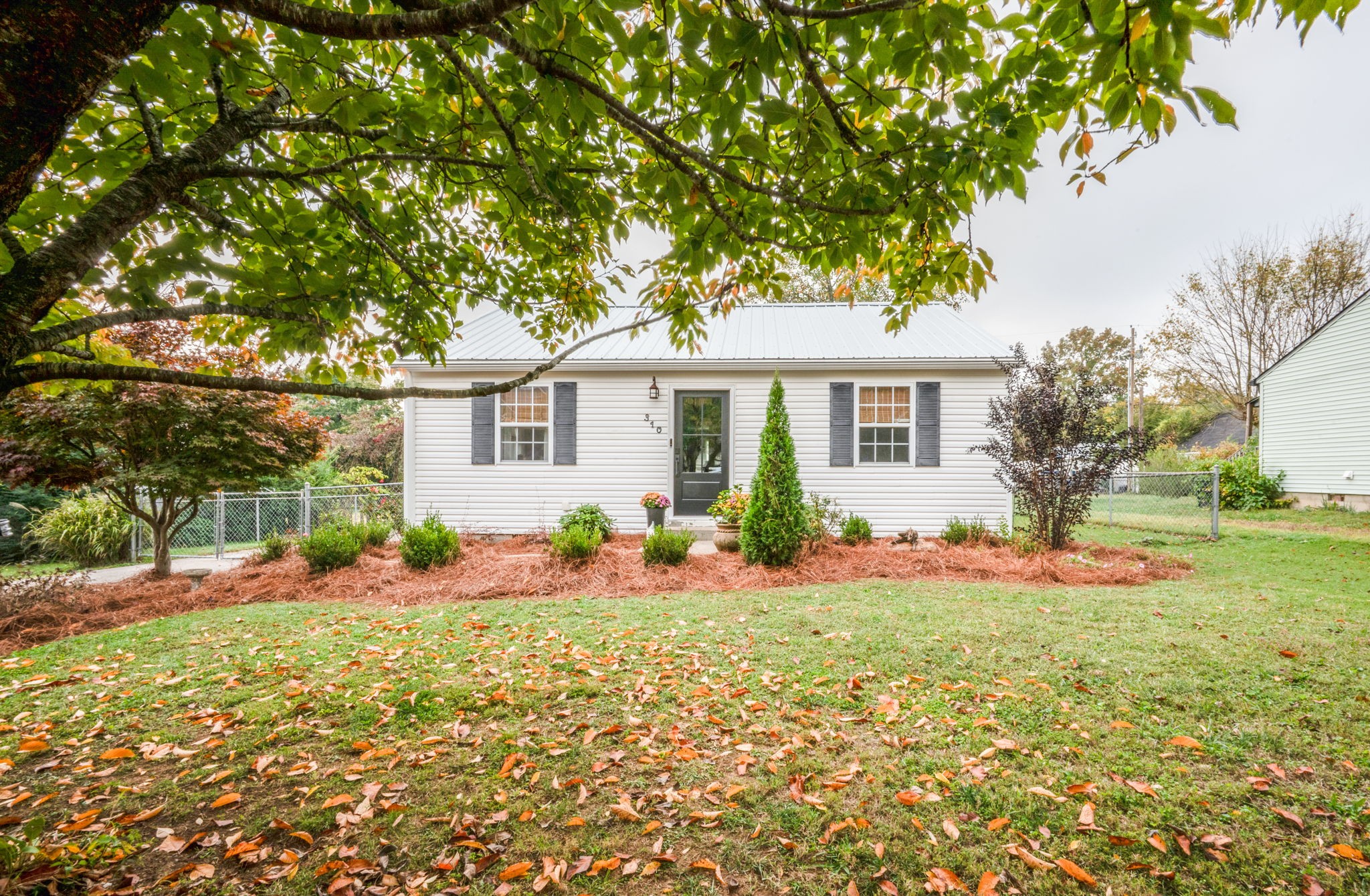 front view of a house with a yard