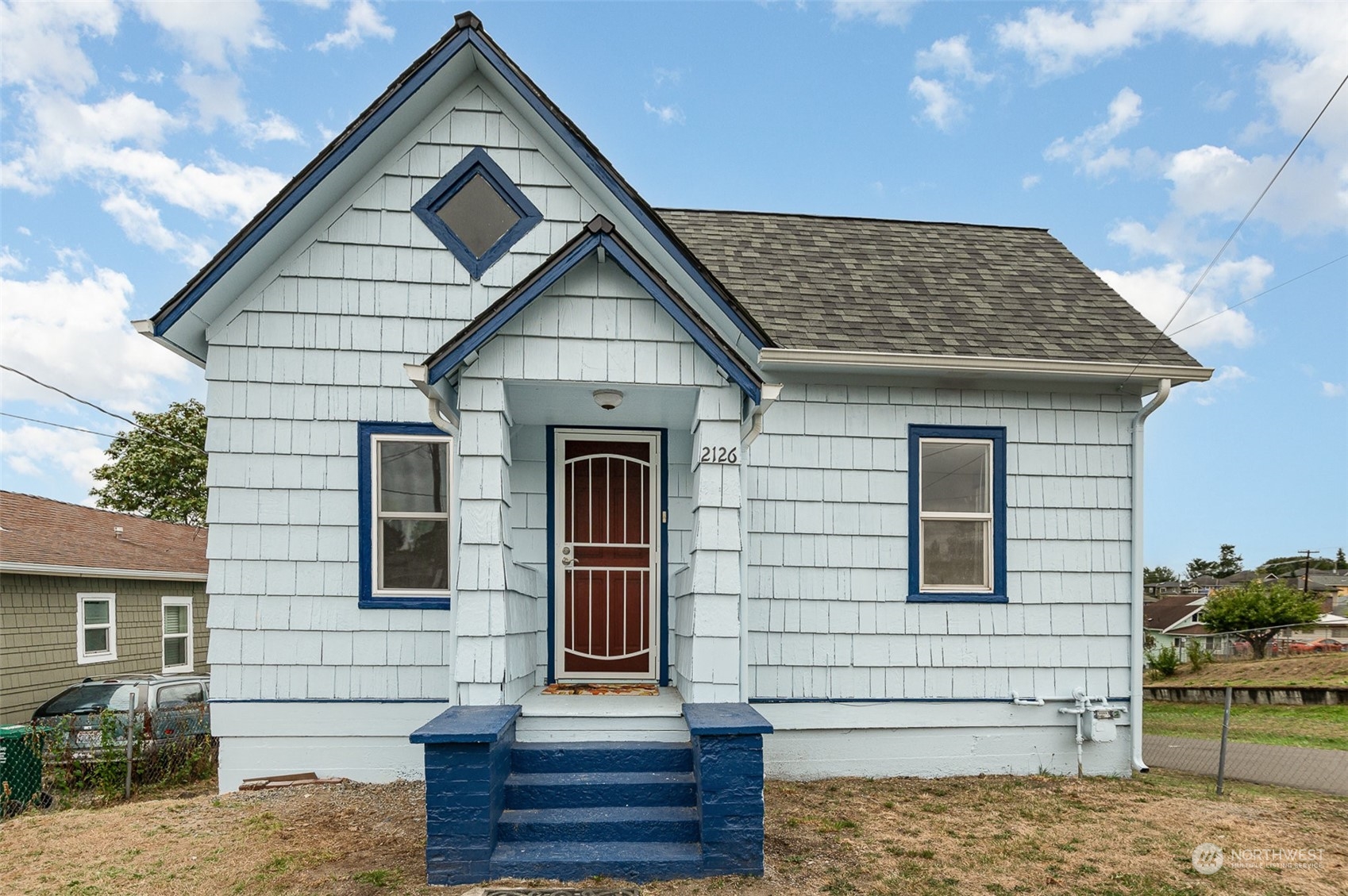 a front view of a house with a yard