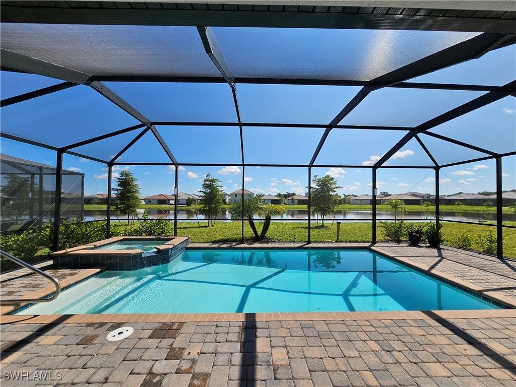 a view of swimming pool with seating space