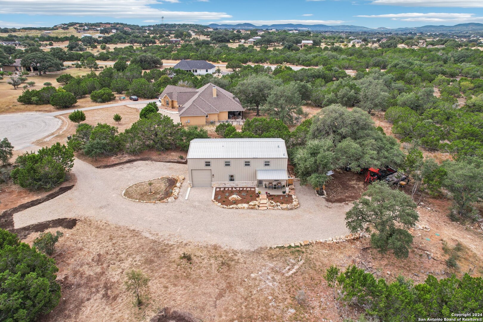 an aerial view of a house with a outdoor space