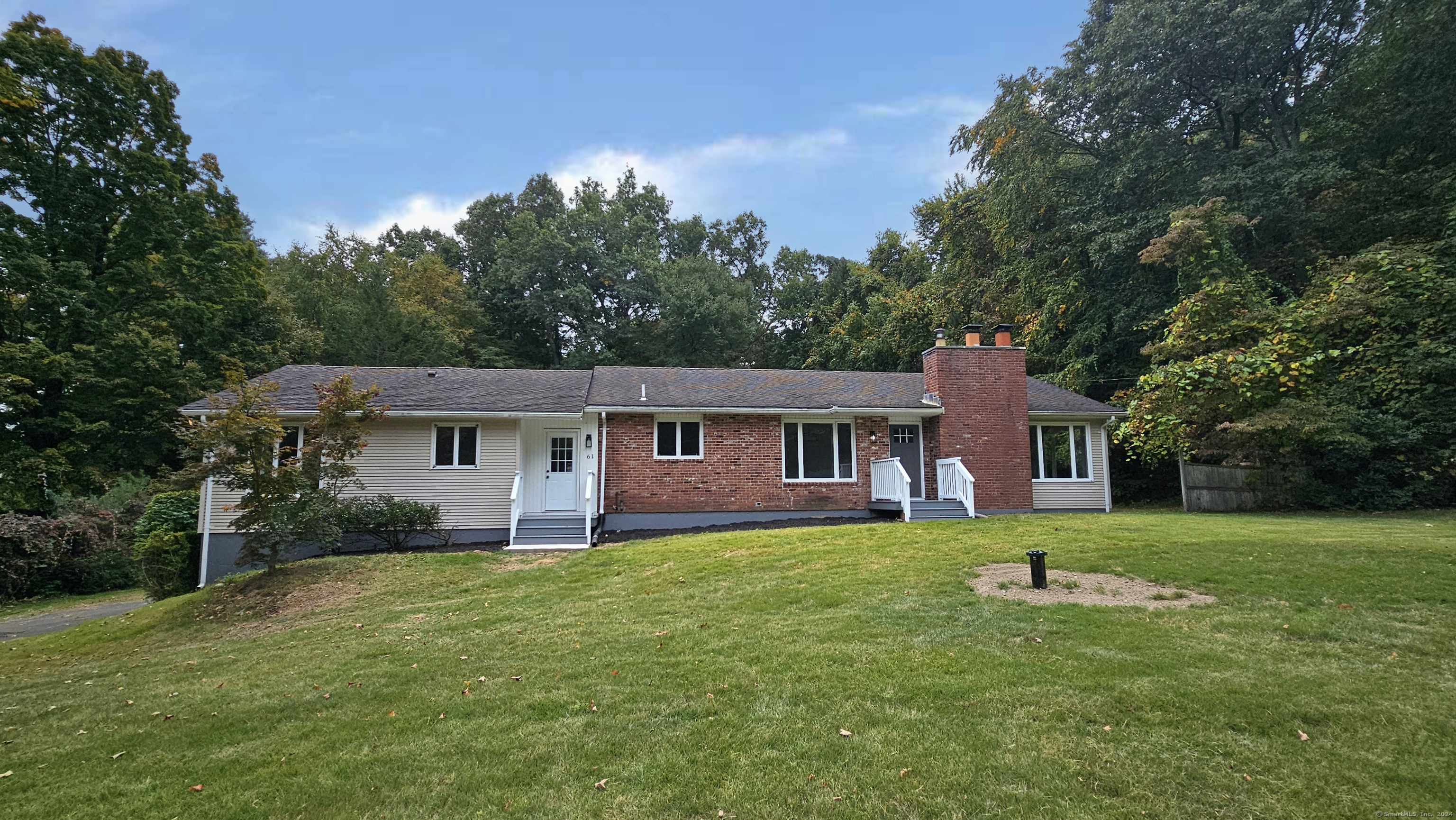 front view of a house with a yard