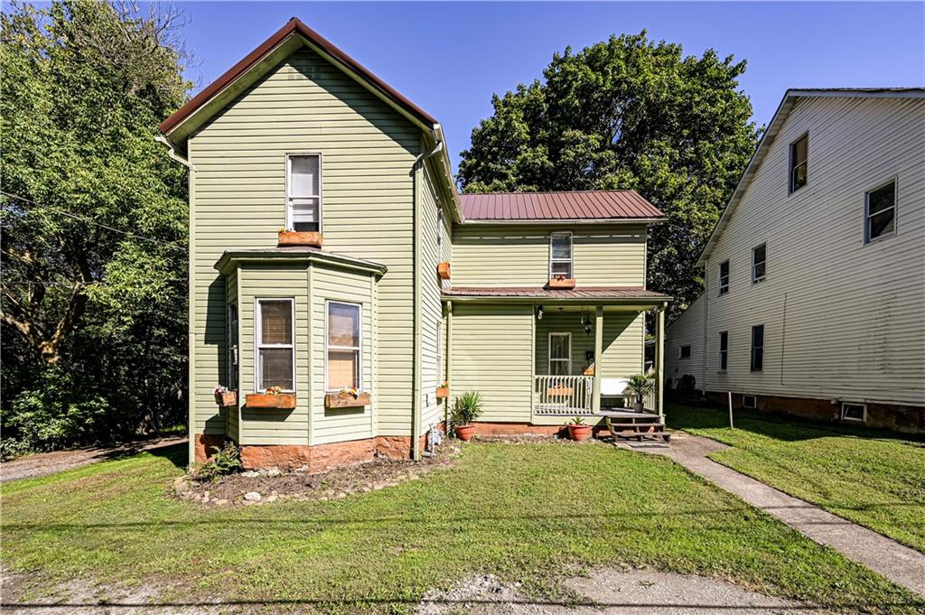 front view of a house with a yard