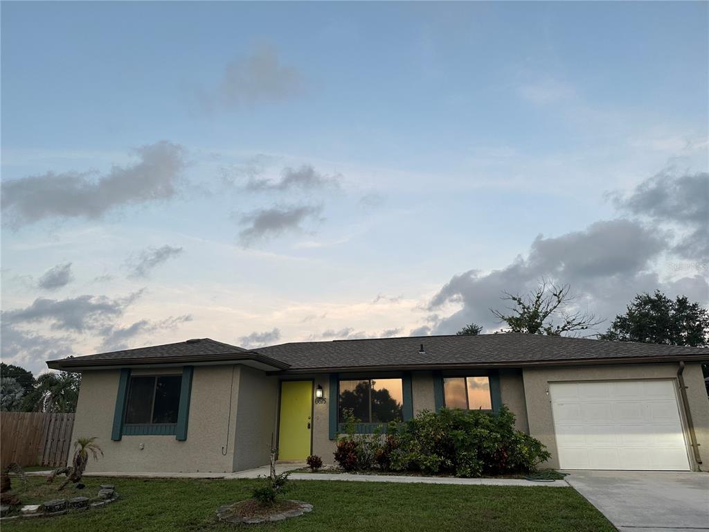 a view of house with yard outdoor seating area and entertaining space