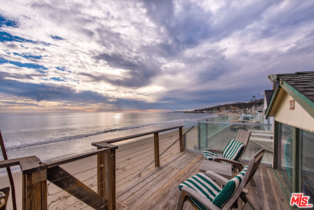 a view of balcony with wooden floor and city view