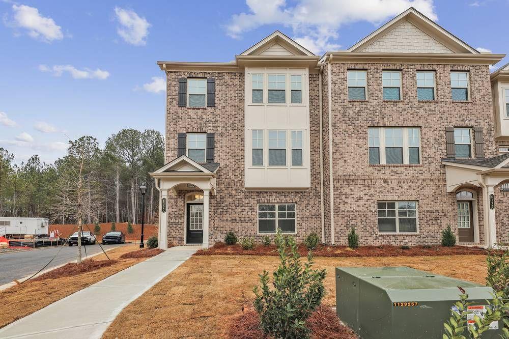 a front view of a house with a yard