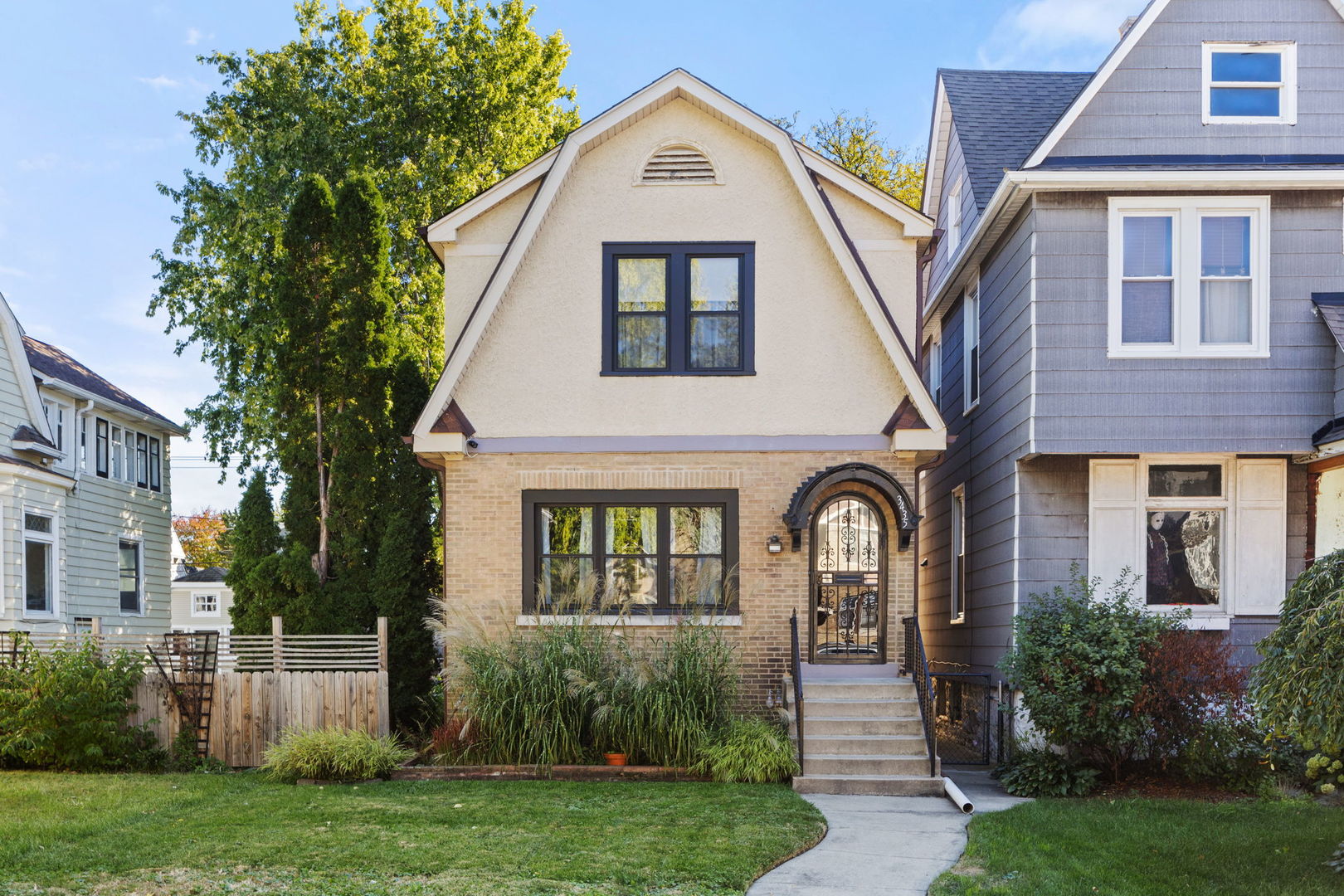 a front view of a house with garden