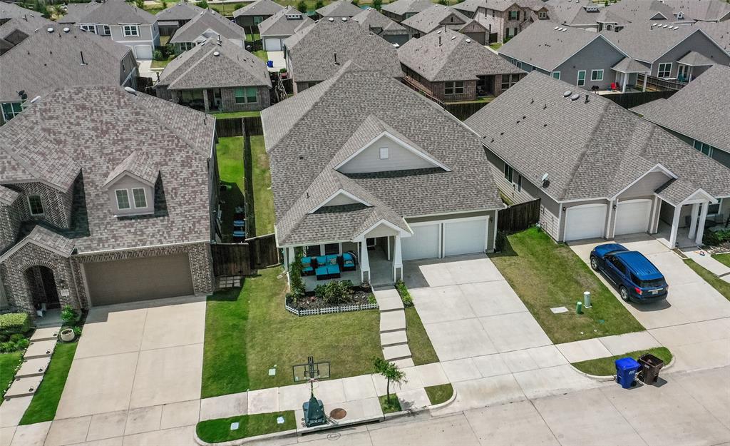 an aerial view of a house with swimming pool