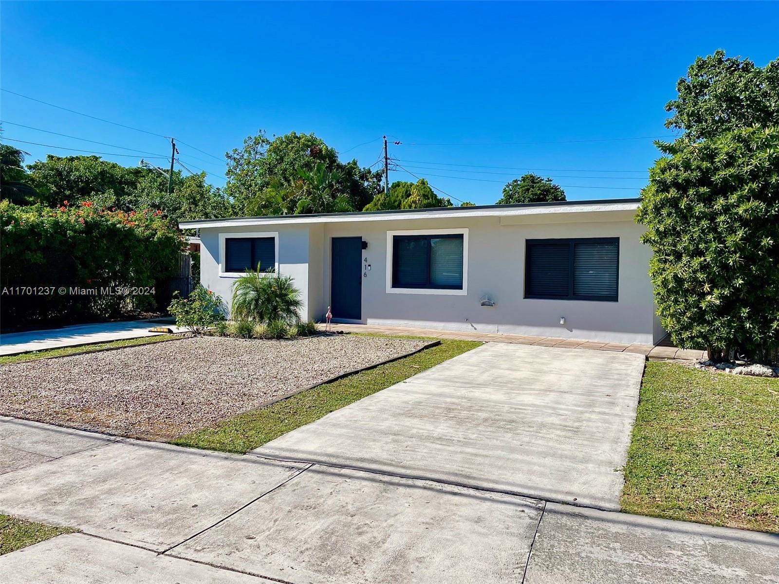 a front view of a house with yard