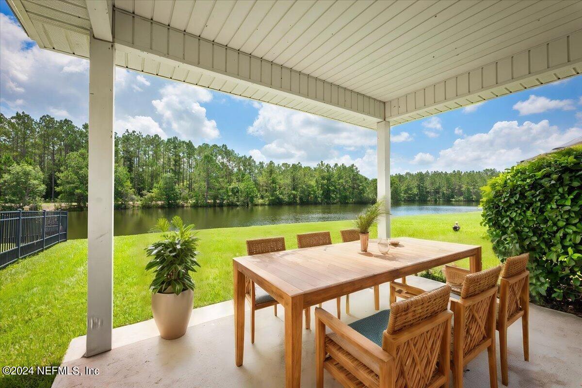 a view of a patio with swimming pool and outdoor seating