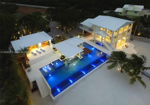 an aerial view of a pool patio swimming pool and outdoor seating