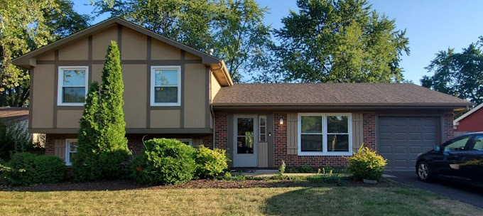 a front view of a house with garden