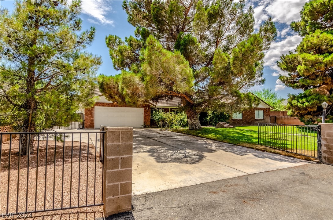 Large paved driveway to front of home, with large