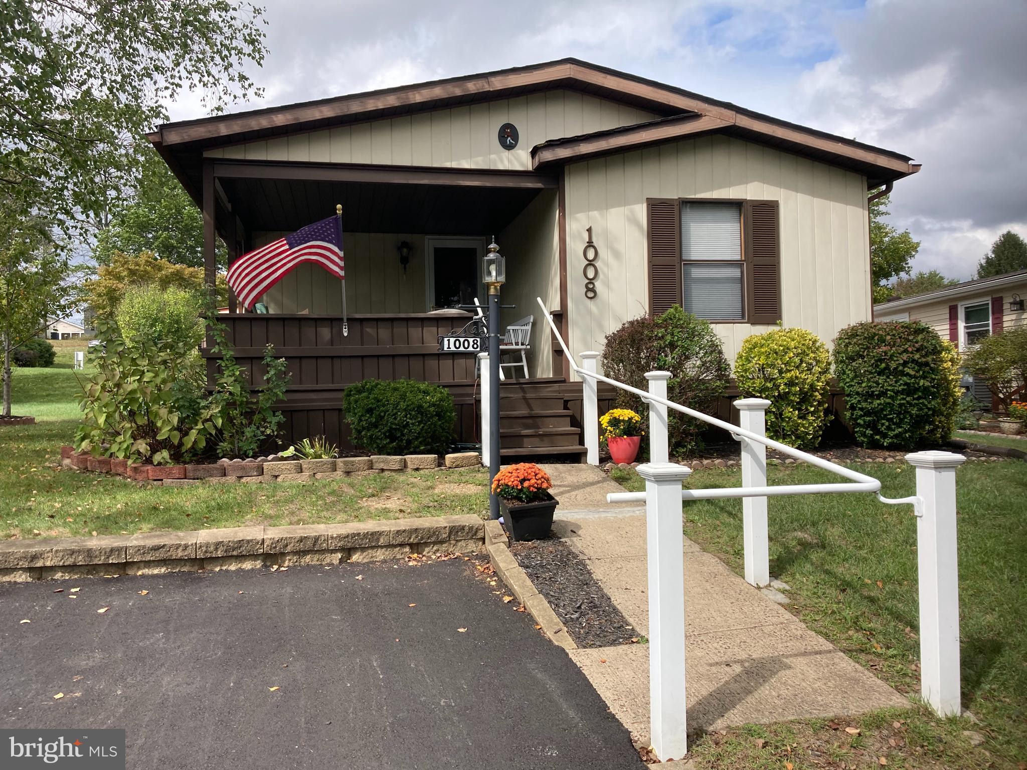 a view of house with outdoor space and porch