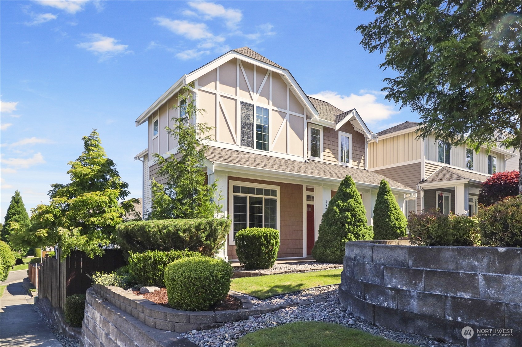 a front view of house with yard and green space