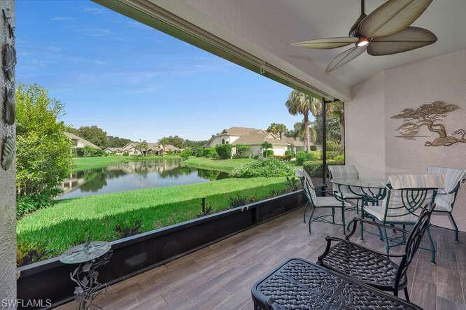 a view of a porch with furniture and yard