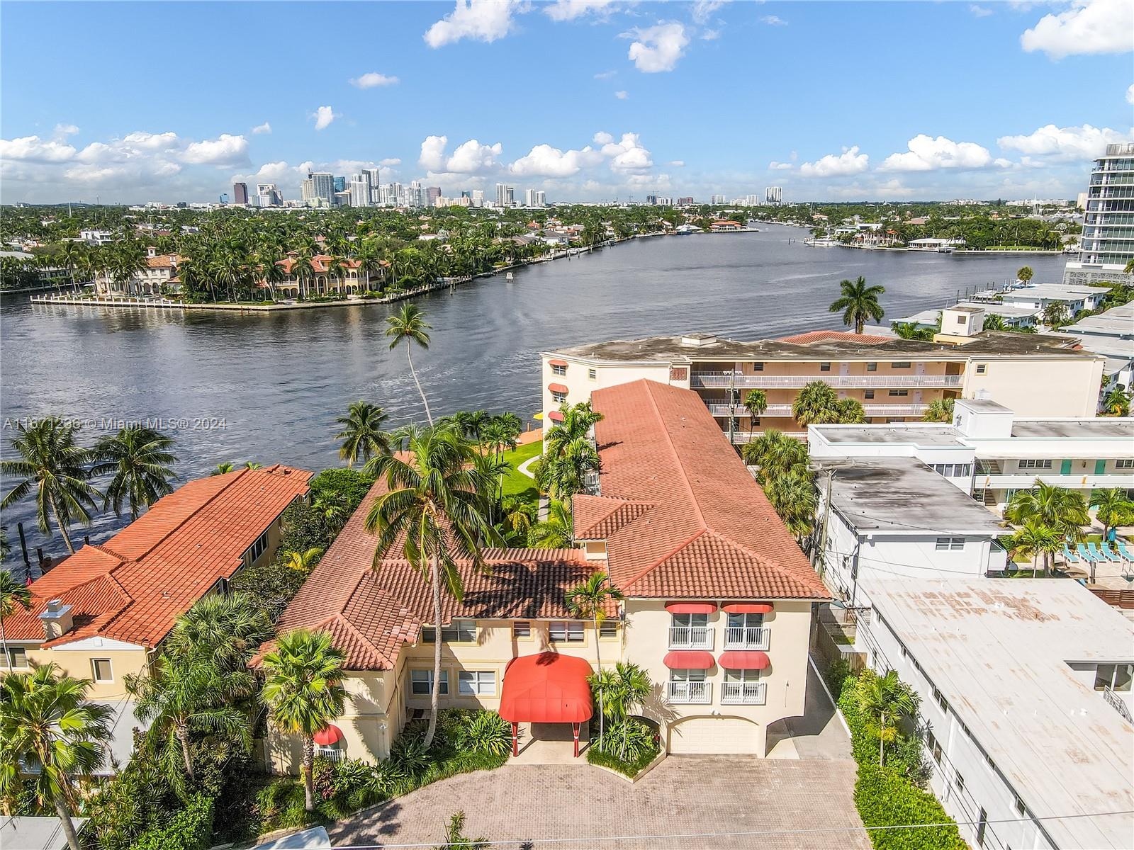 an aerial view of a house with a lake view