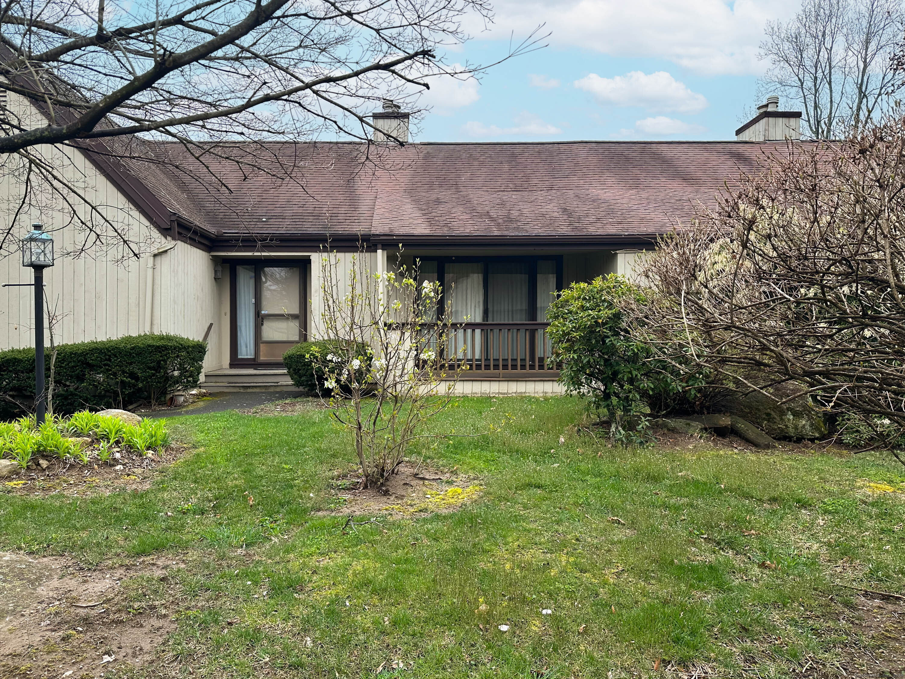 a view of a house with a backyard and garden