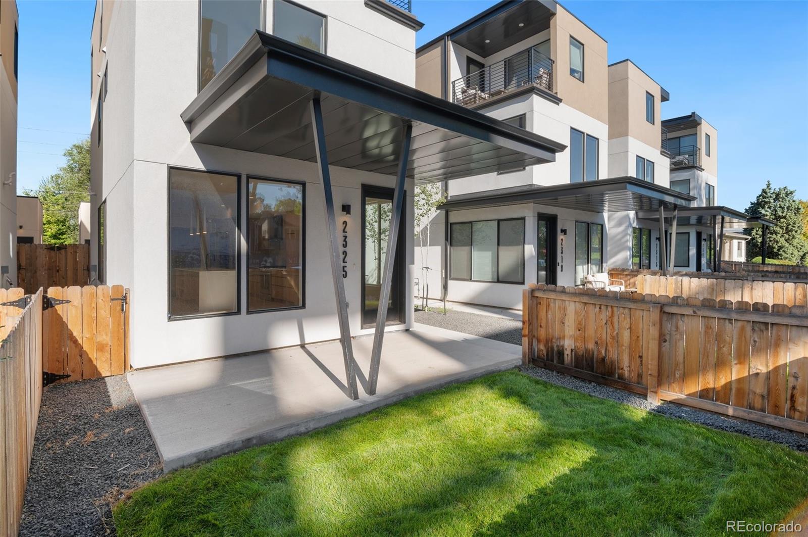 a view of a house with a yard porch and sitting area