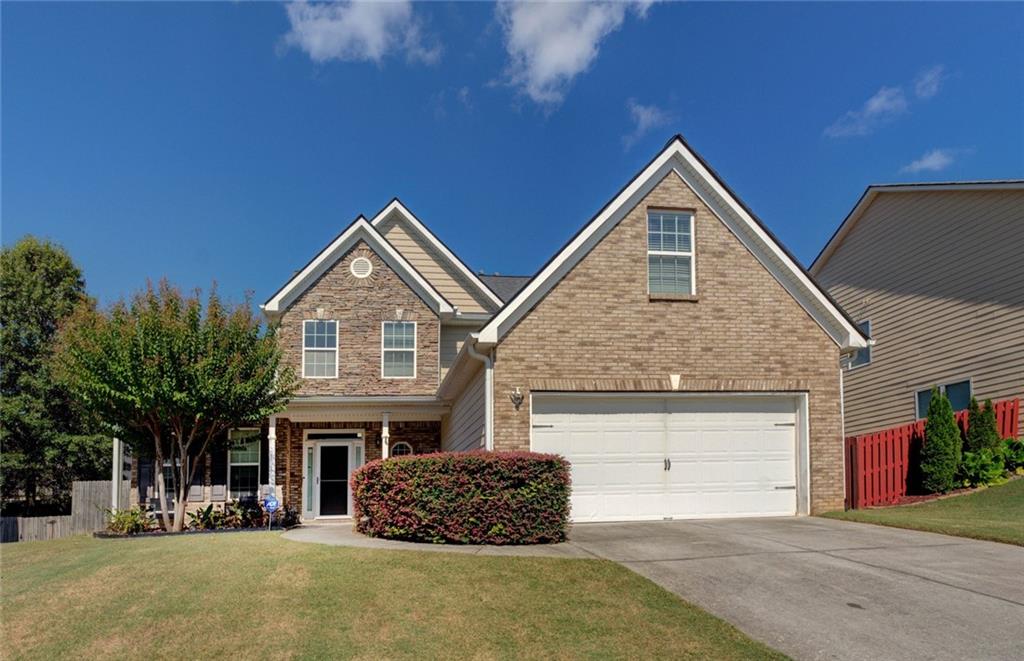 a front view of a house with a garage