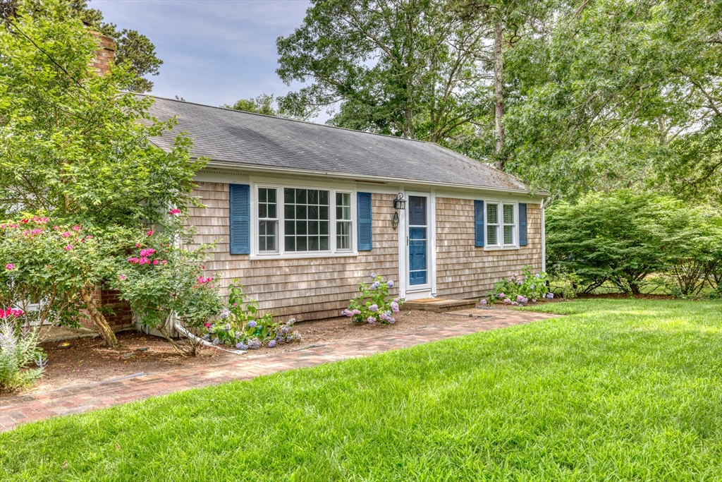 front view of a house with a yard