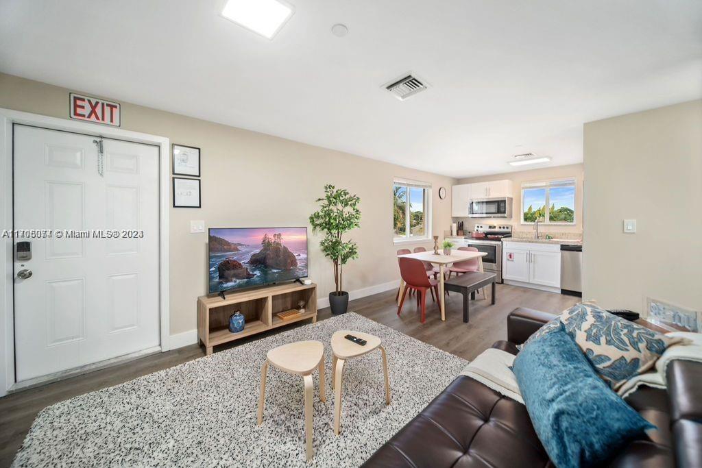 a living room with furniture and a rug