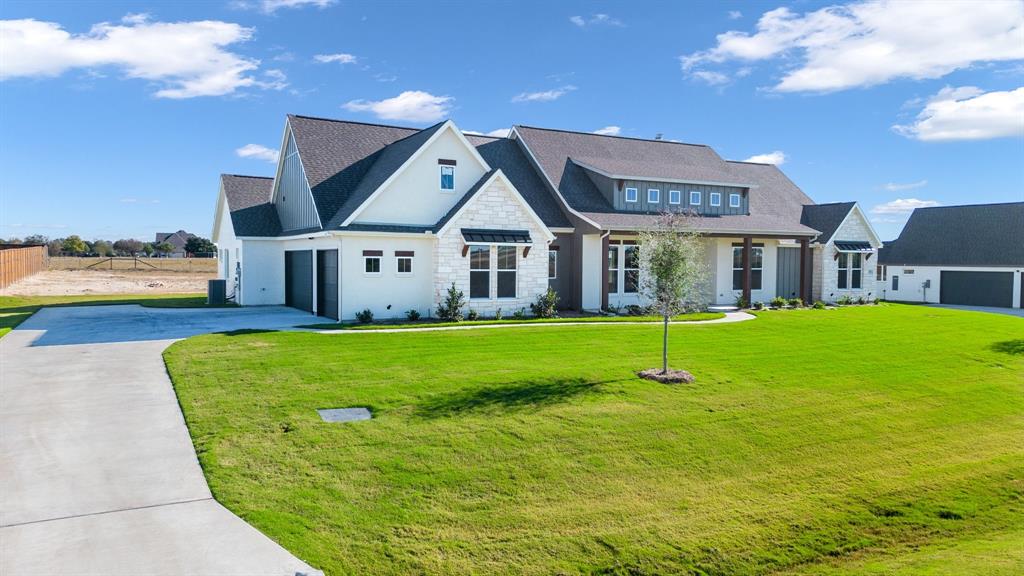 a view of a house with a big yard