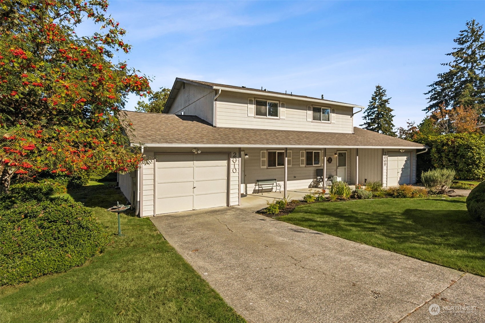 a front view of a house with a yard and porch