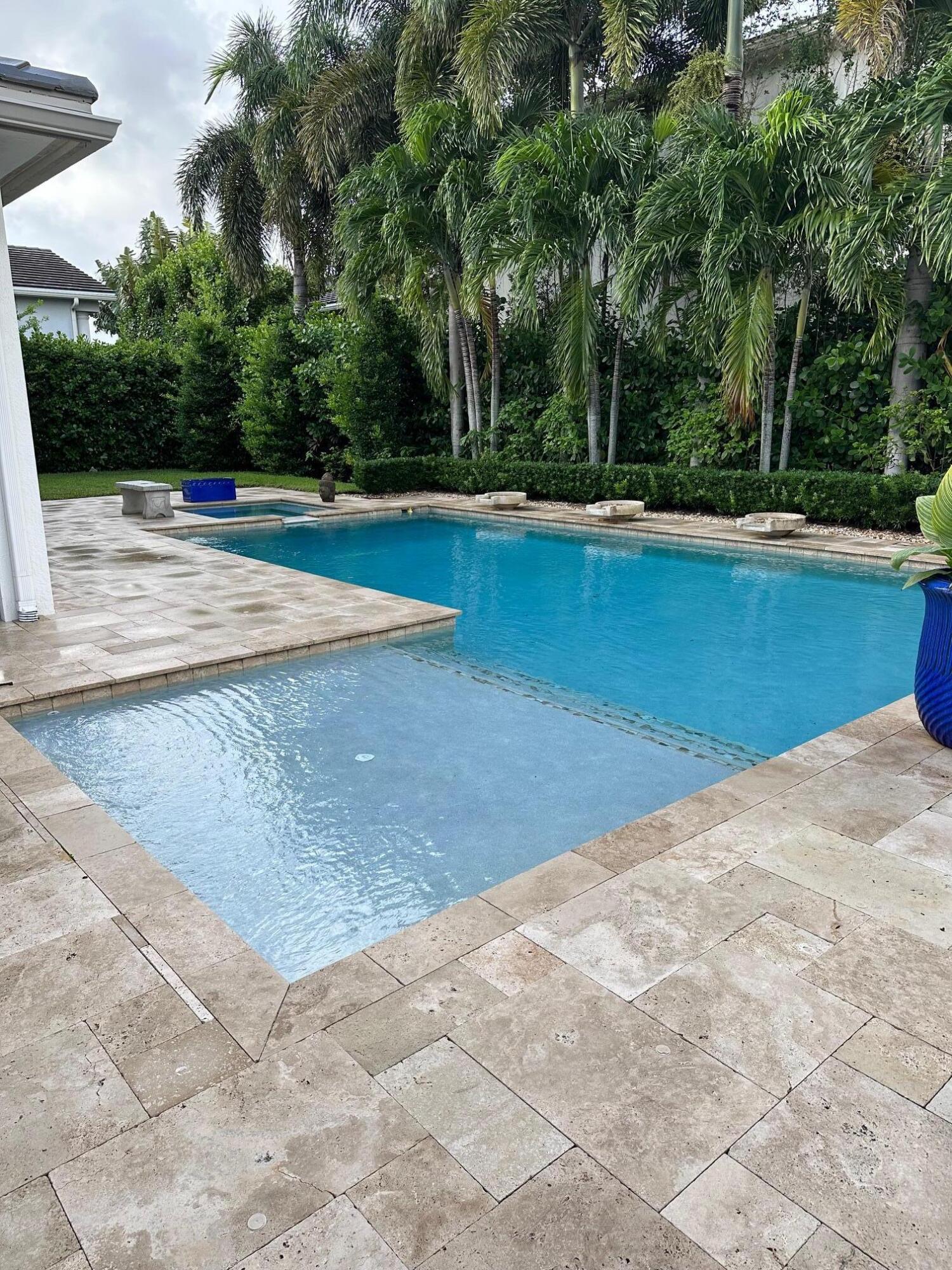 a view of swimming pool with an outdoor seating and yard