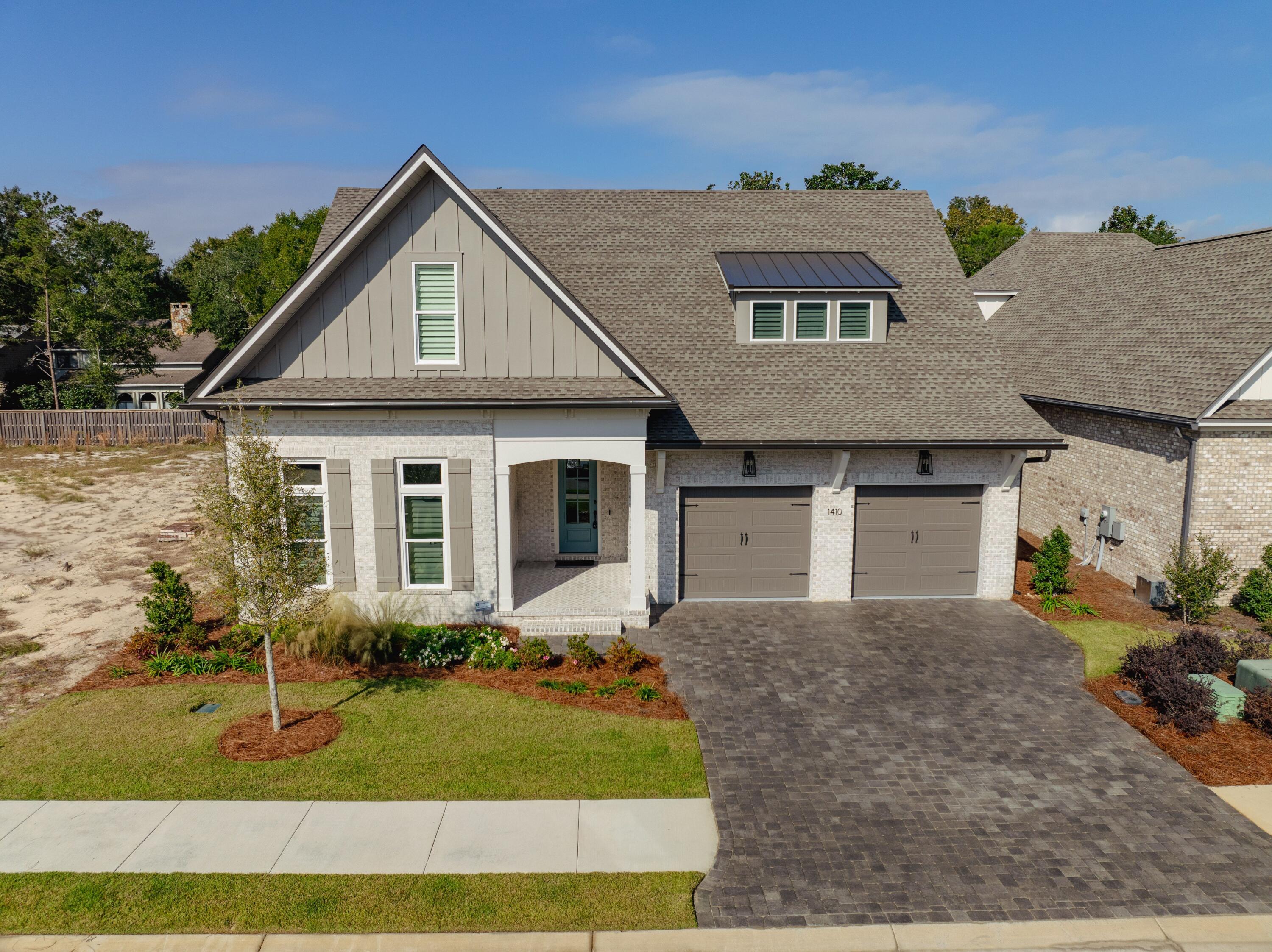 a view of a big house with a yard