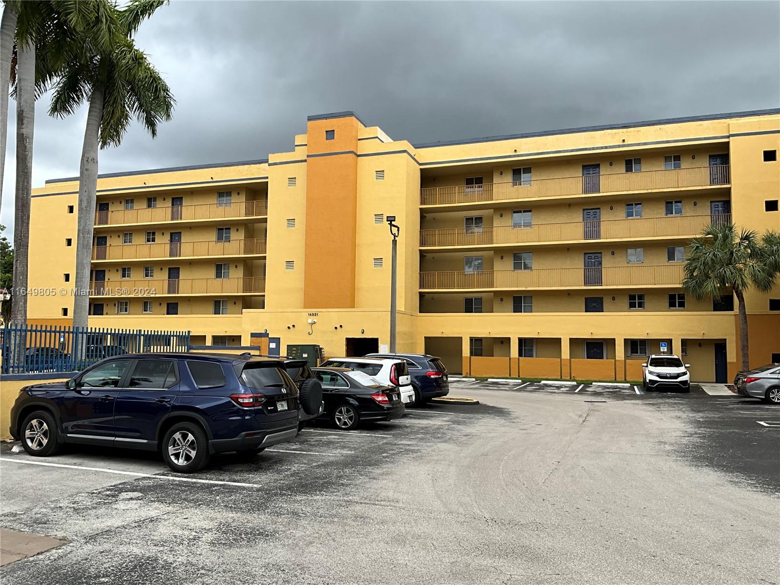 a view of a cars parked in front of a building