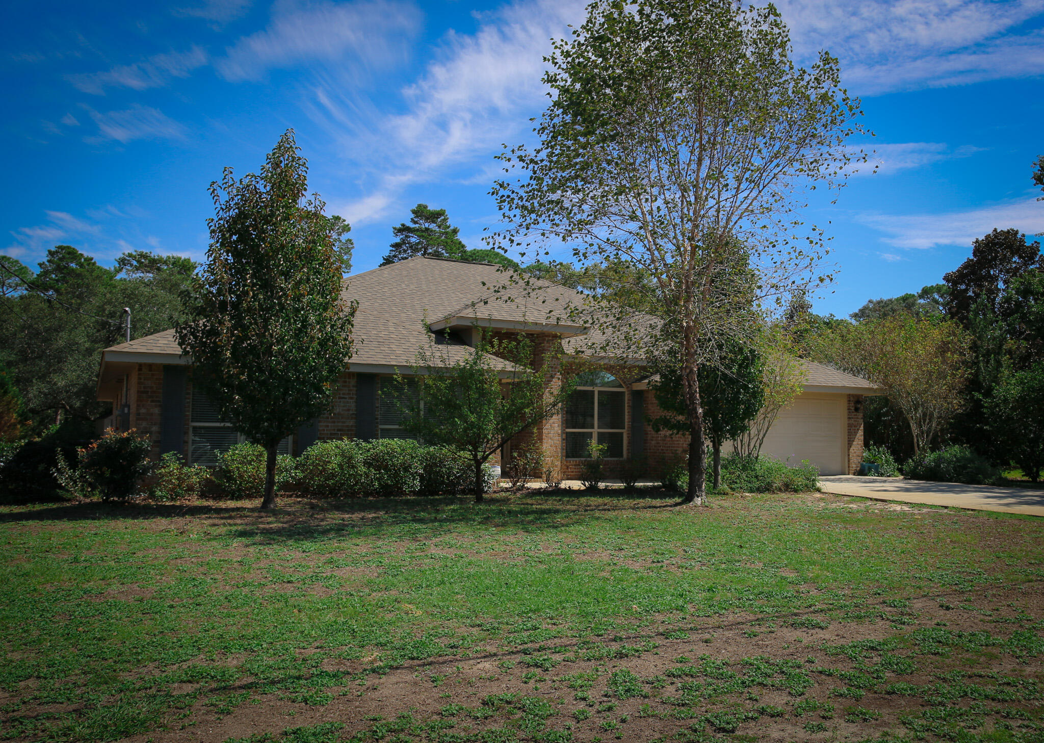 a view of a house with a yard porch and sitting area