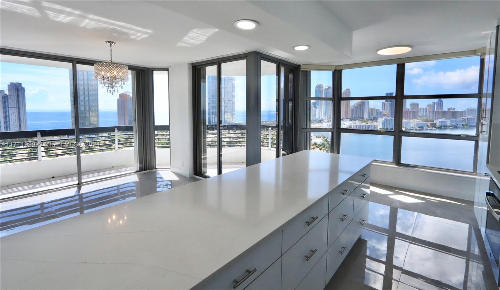 a view of a kitchen with lots of counter top space