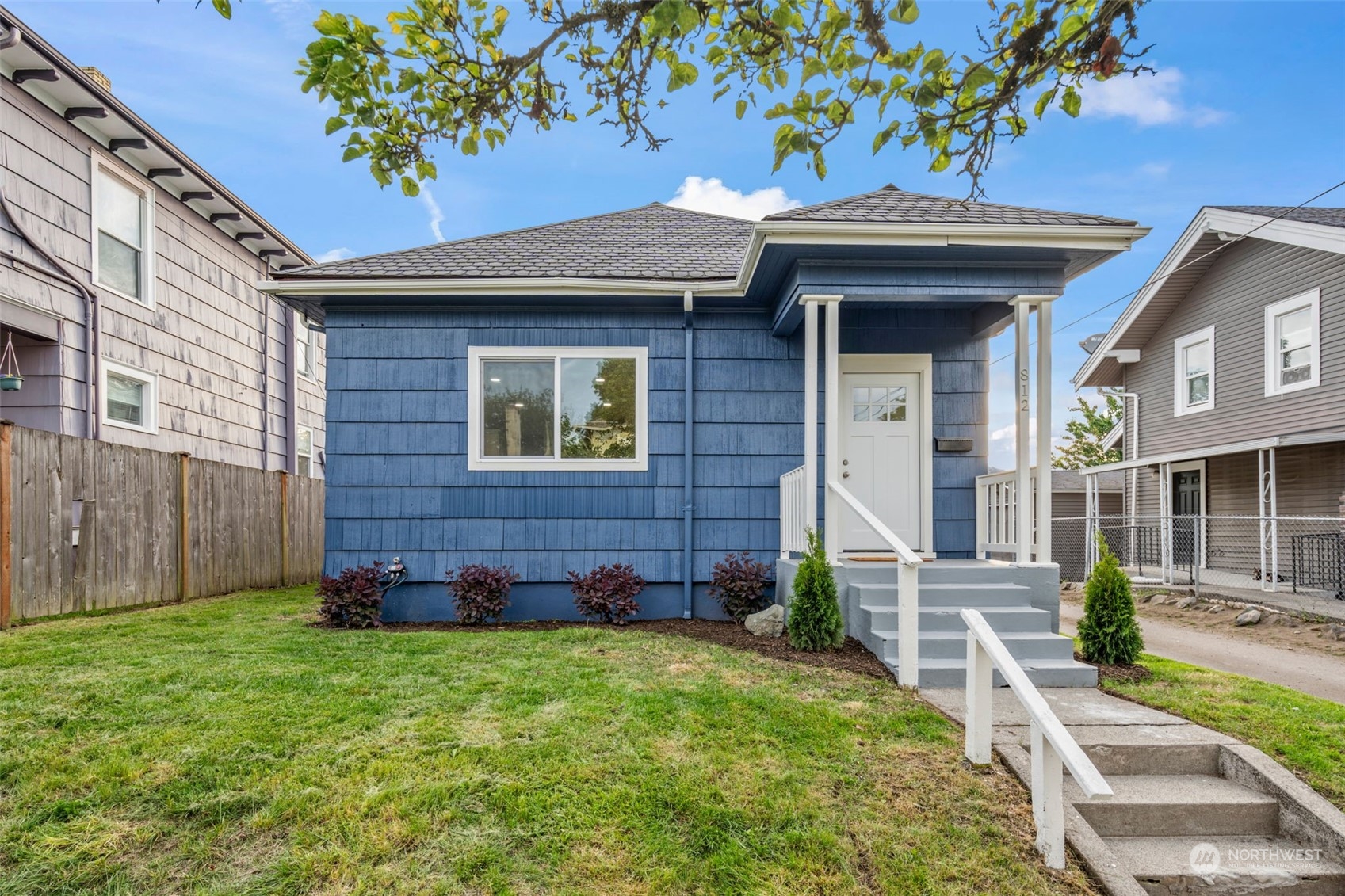 a front view of a house with garden