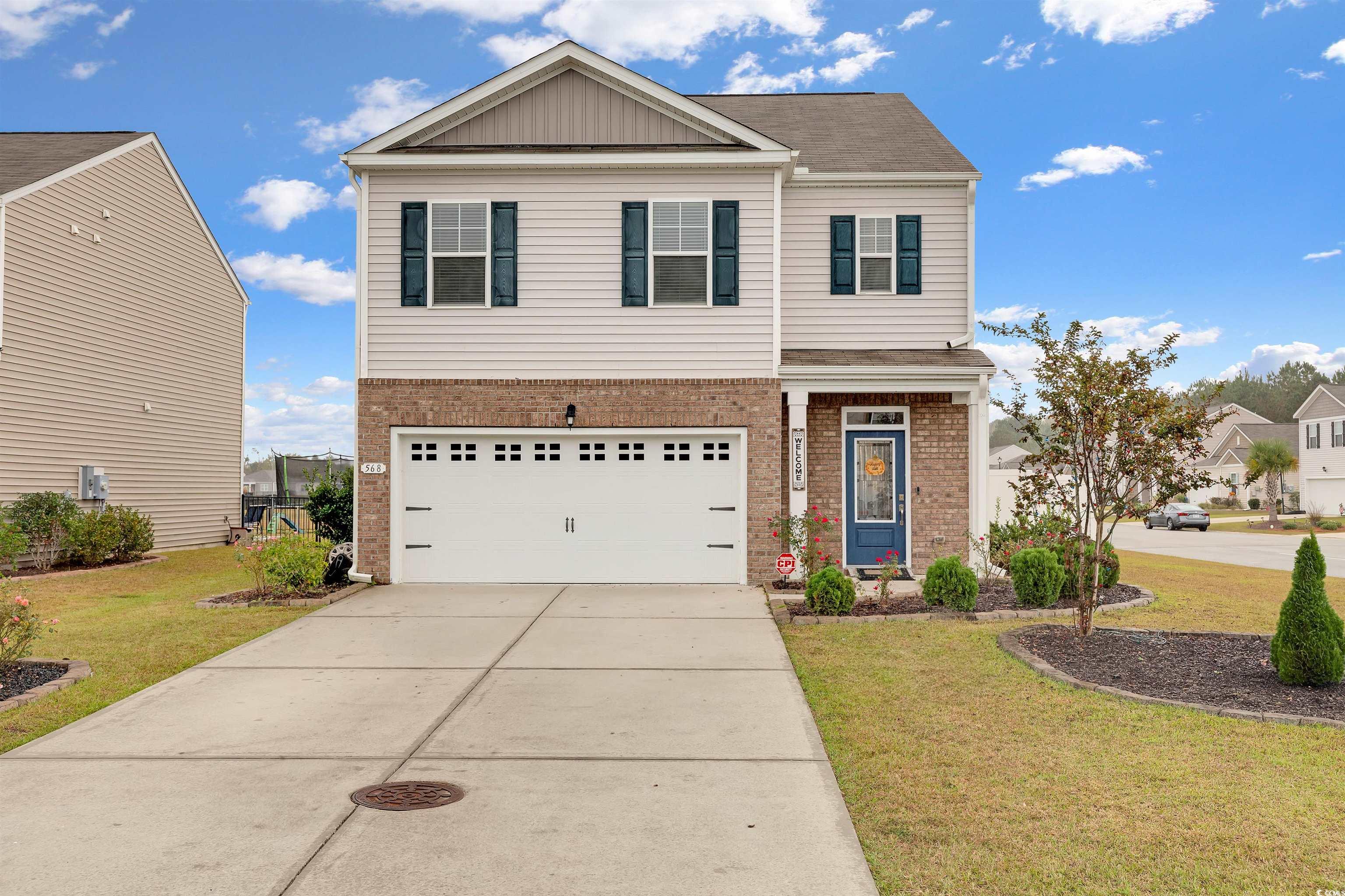 View of front of property featuring a front yard a