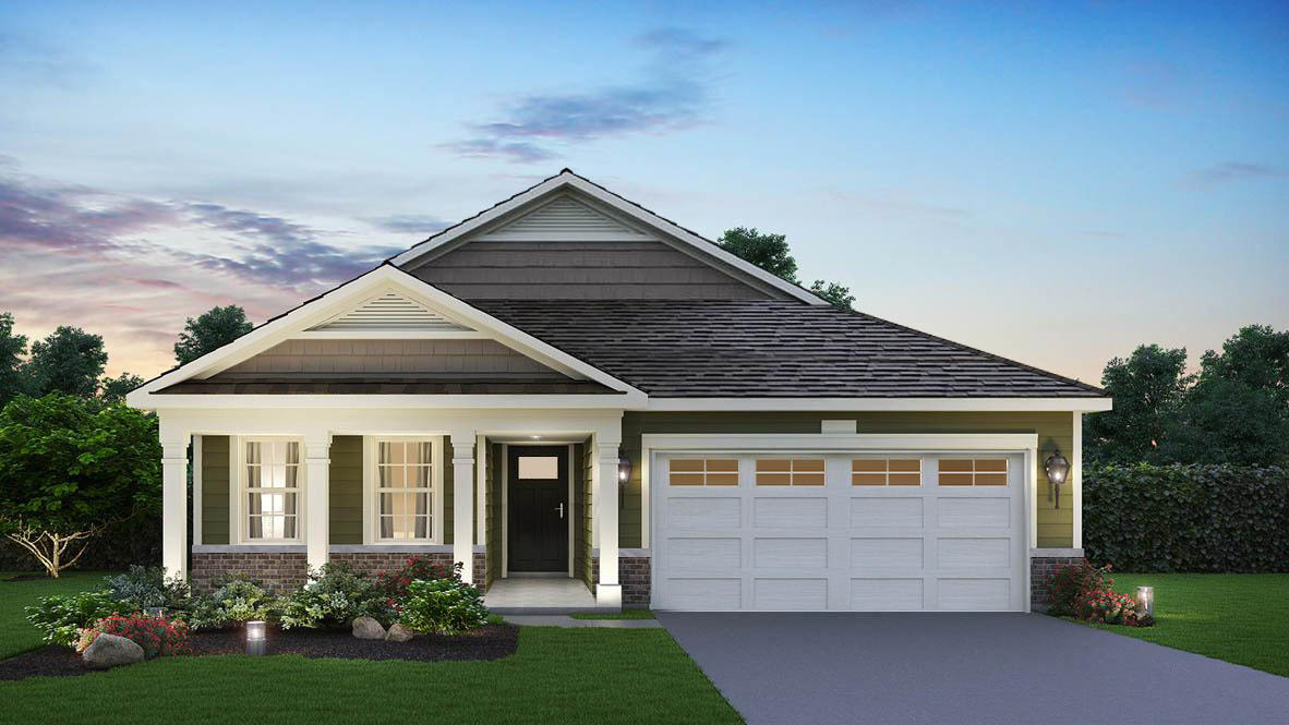 a front view of a house with a garden and garage