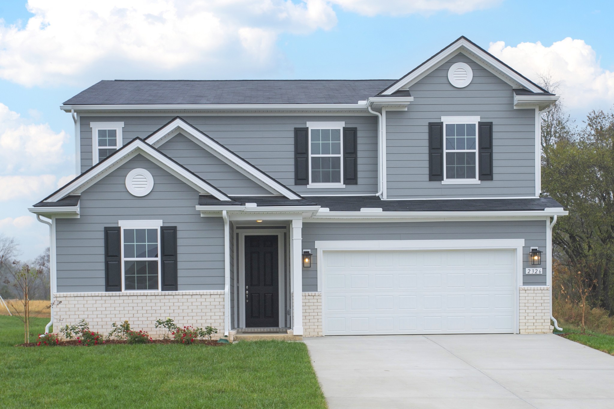 front view of a house with a yard