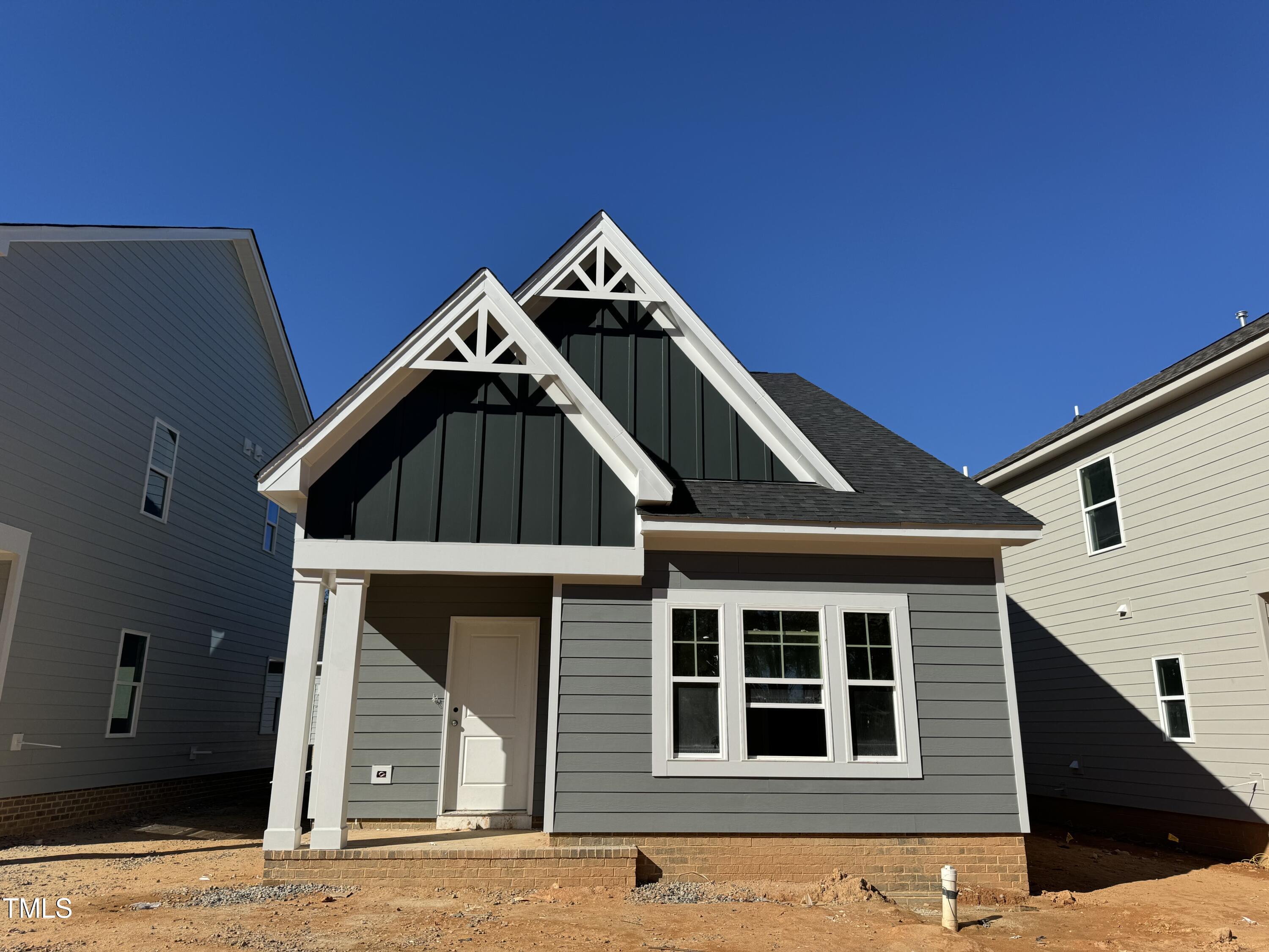 a front view of a house with garage