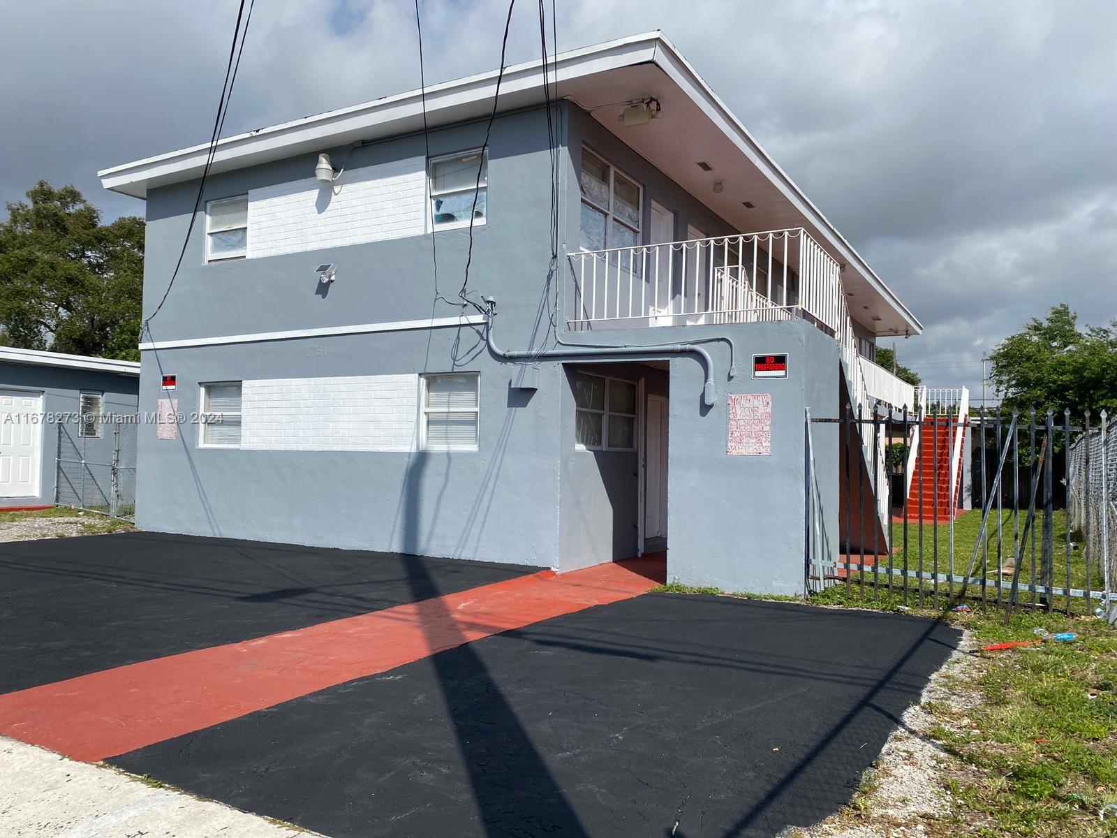 a front view of house with street