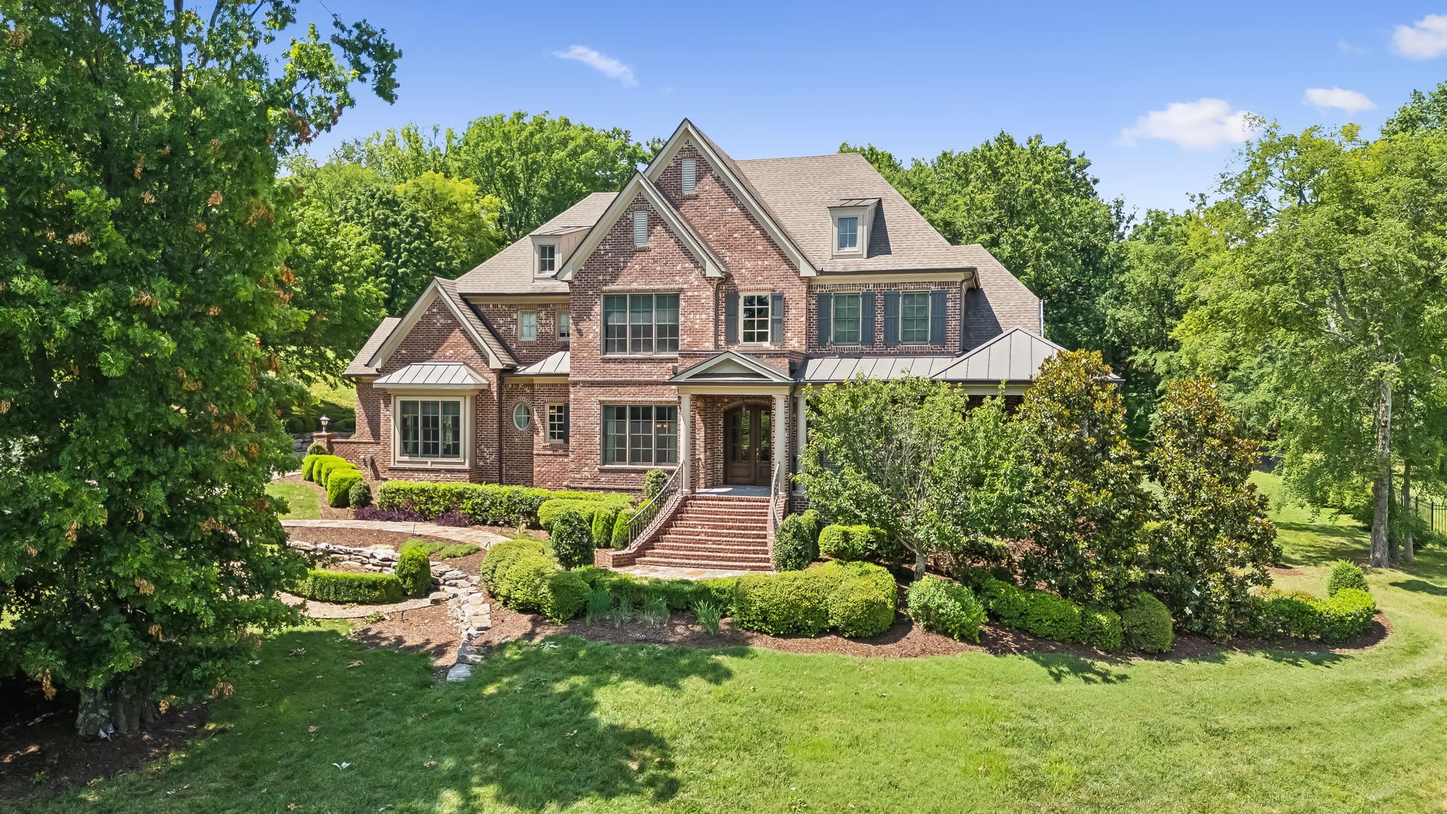 a front view of a house with a yard