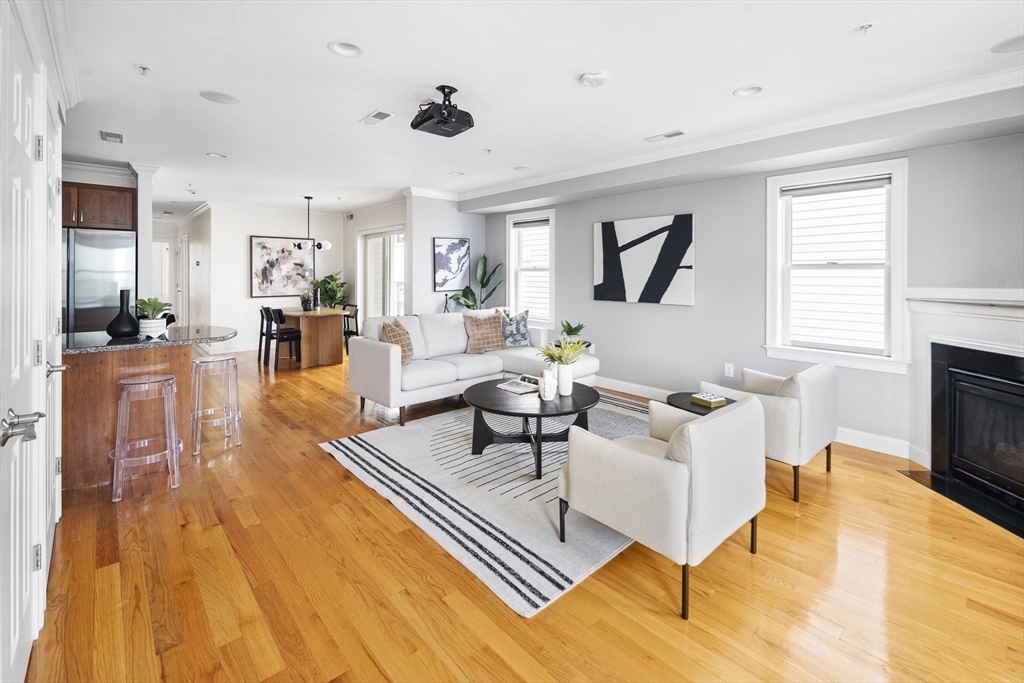 a living room with fireplace furniture and a flat screen tv