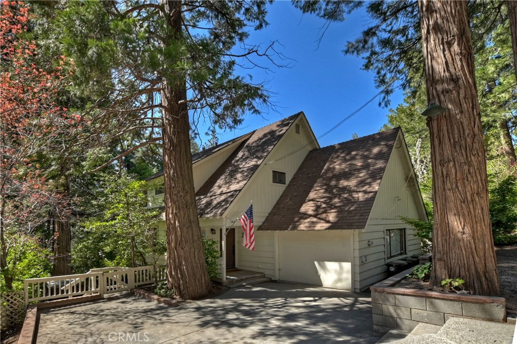 a view of a house with a tree