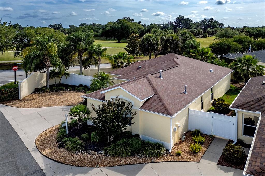 an aerial view of a house with a garden