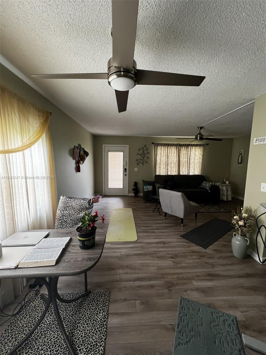 a living room with furniture rug and window