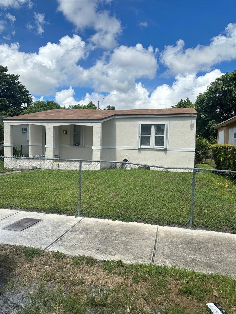 front view of a house and a yard