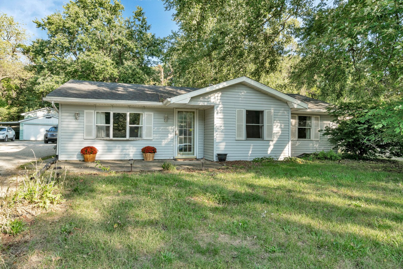 a front view of house with yard and seating area