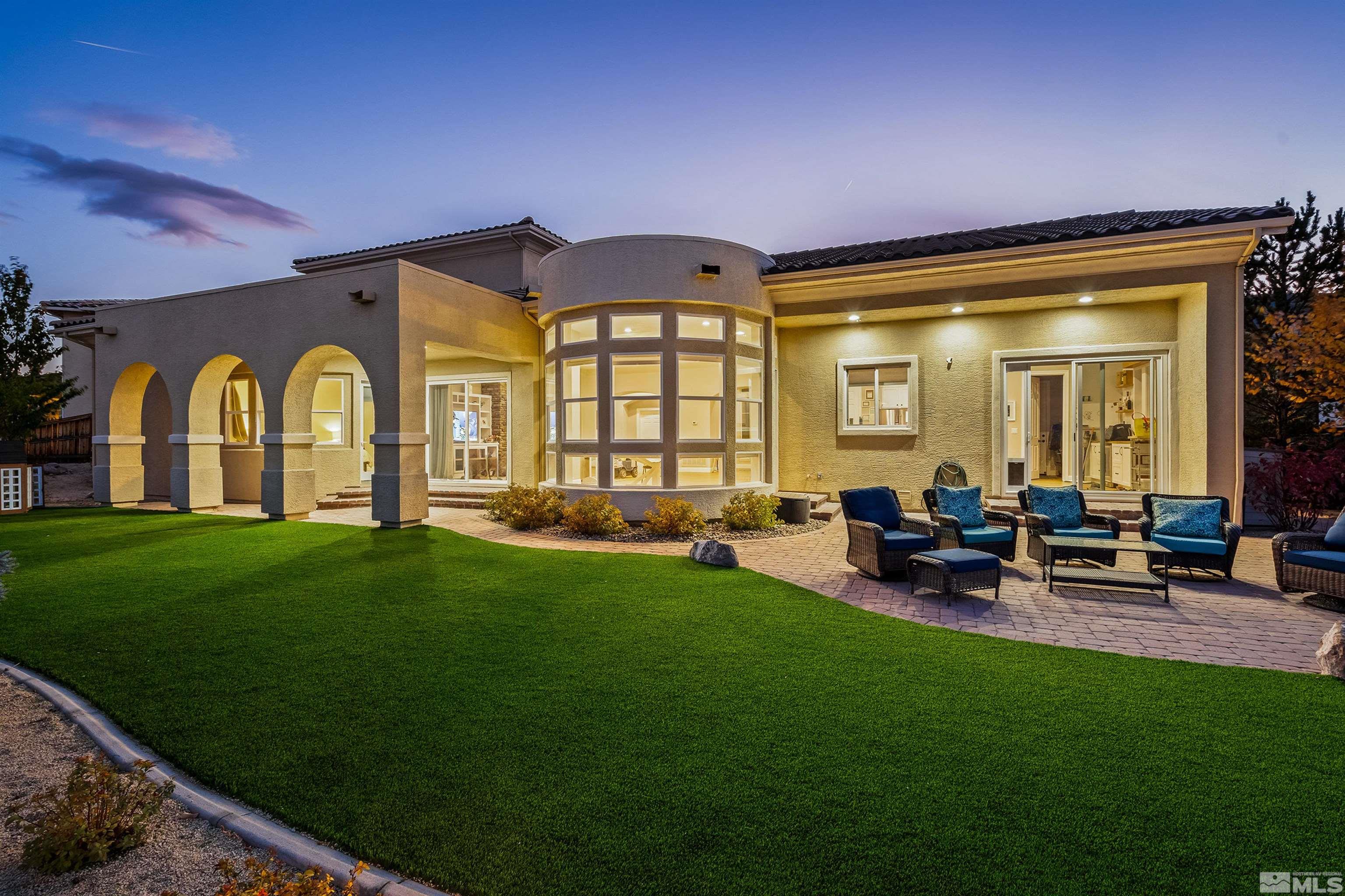 a view of swimming pool with outdoor seating