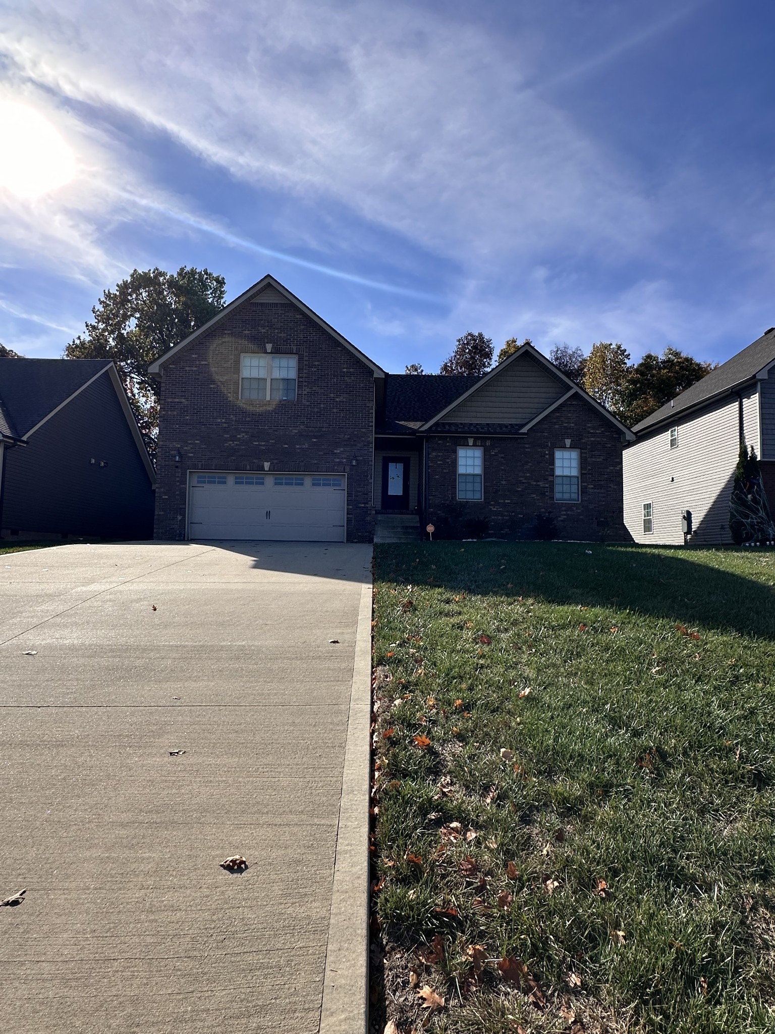 a front view of a house with a yard