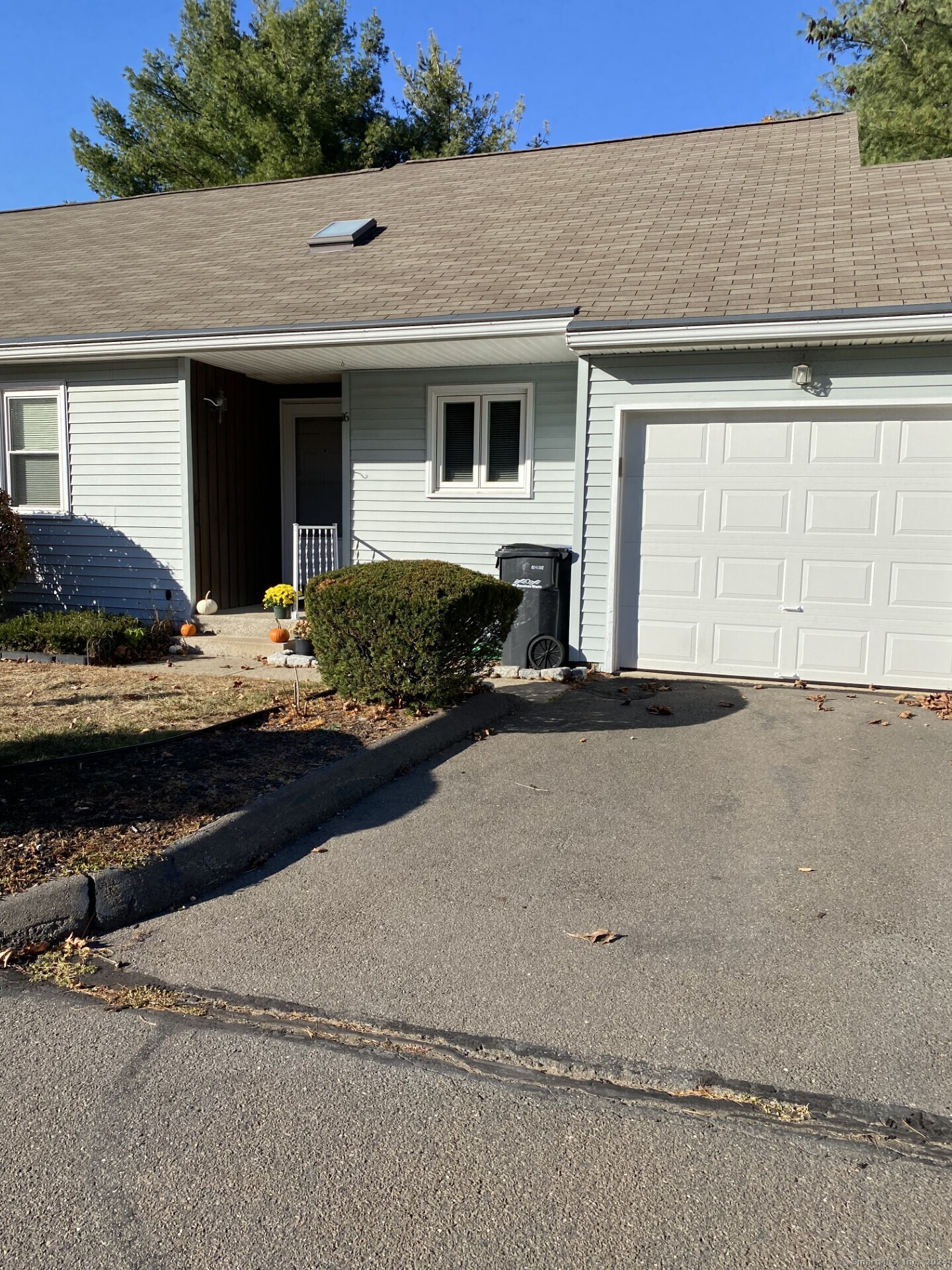 a front view of a house with yard